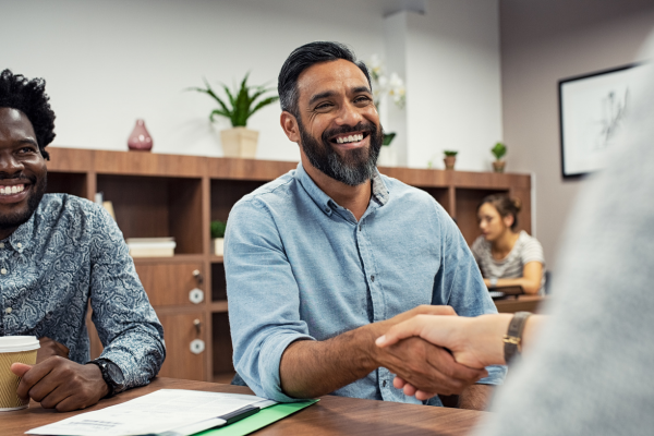 Person shaking hands after buying a business