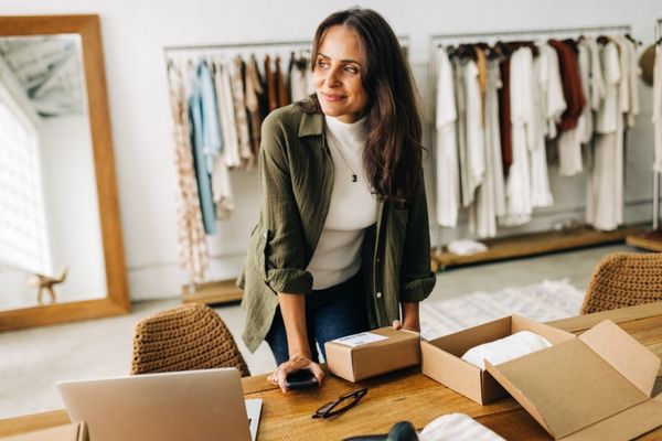 Small business owner packing goods and services for exporting into a new reginal, provincial or international market