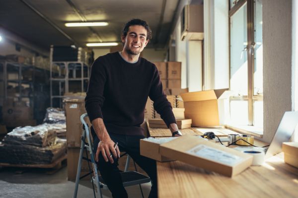 Person sitting at a desk with packages